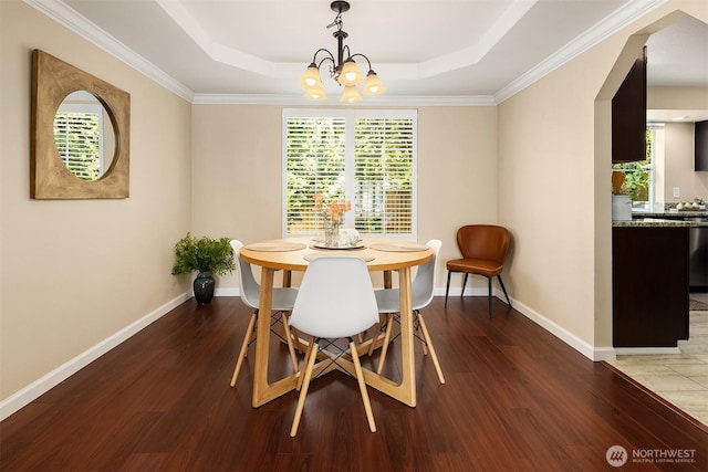 600 213th St SW, Bothell, WA 98021 - dining space with a chandelier, wood finished floors, a tray ceiling, and ornamental molding
