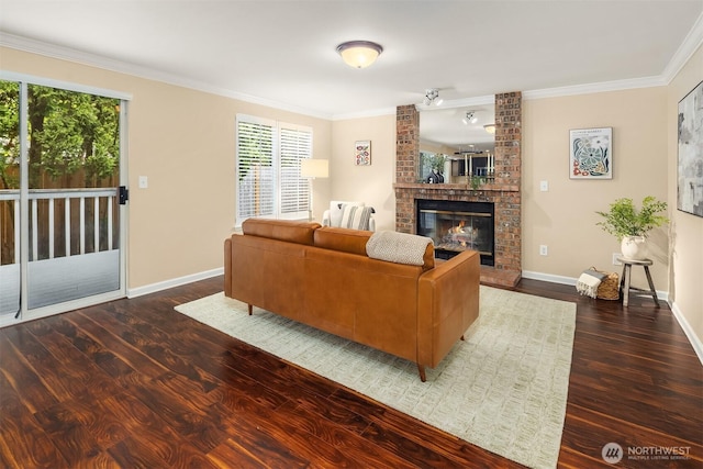 600 213th St SW, Bothell, WA 98021 - living area featuring wood finished floors, a brick fireplace, and crown molding