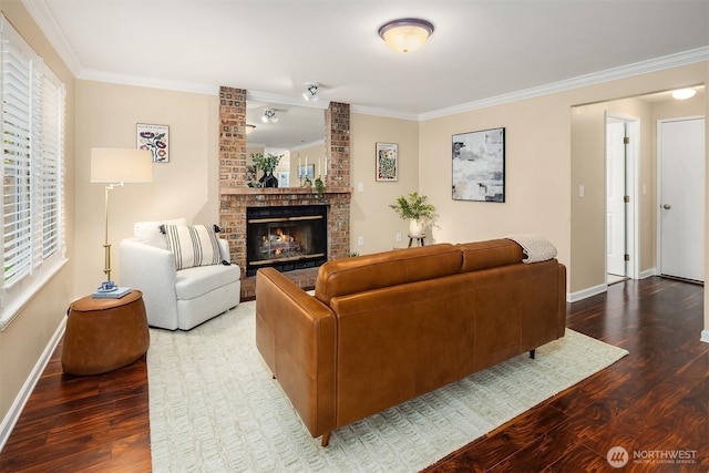 600 213th St SW, Bothell, WA 98021 - living room featuring wood finished floors, crown molding, and a brick fireplace