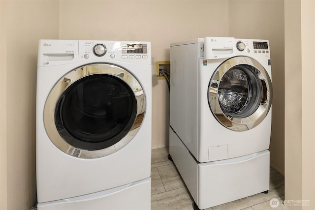 600 213th St SW, Bothell, WA 98021 - washroom featuring independent washer and dryer and light tile patterned floors