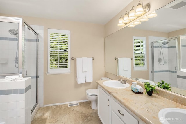 600 213th St SW, Bothell, WA 98021 - full bathroom featuring healthy amount of natural light, double vanity, a stall shower, and tile patterned floors