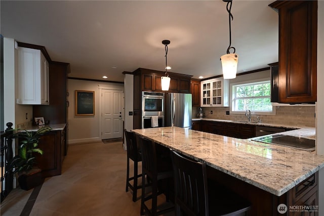 804 S Park Ct, Lynden, WA 98264 - kitchen with stainless steel appliances, a peninsula, recessed lighting, light stone countertops, and tasteful backsplash