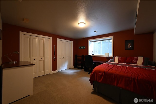804 S Park Ct, Lynden, WA 98264 - carpeted bedroom featuring two closets and baseboards