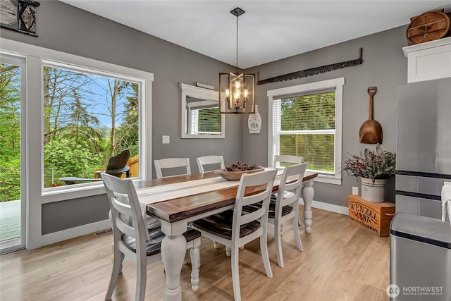 17501 Clearlake Blvd SE, Yelm, WA 98597 - dining space with a chandelier and light wood-type flooring