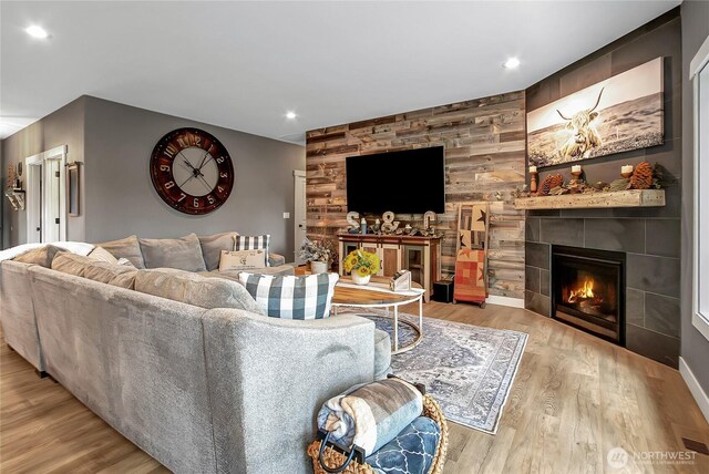 17501 Clearlake Blvd SE, Yelm, WA 98597 - living area featuring a tile fireplace, wood finished floors, and recessed lighting