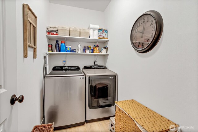 17501 Clearlake Blvd SE, Yelm, WA 98597 - laundry room with washing machine and clothes dryer and light wood-style flooring