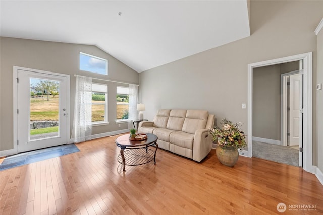 7114 Hazel Pl SE, Auburn, WA 98092 - living area featuring lofted ceiling and wood finished floors