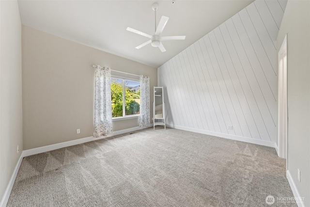 7114 Hazel Pl SE, Auburn, WA 98092 - carpeted spare room featuring vaulted ceiling and a ceiling fan