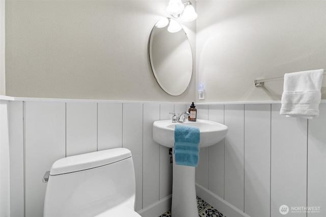 7114 Hazel Pl SE, Auburn, WA 98092 - bathroom with toilet and a wainscoted wall