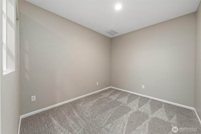 7114 Hazel Pl SE, Auburn, WA 98092 - spare room featuring carpet flooring and baseboards