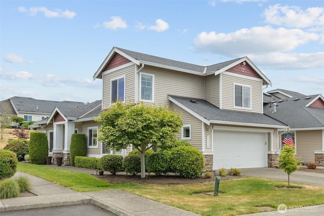 7114 Hazel Pl SE, Auburn, WA 98092 - view of front of home featuring an attached garage, a shingled roof, stone siding, driveway, and a front yard