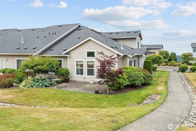 7114 Hazel Pl SE, Auburn, WA 98092 - view of side of home with a patio and a shingled roof