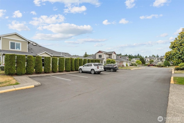 7114 Hazel Pl SE, Auburn, WA 98092 - uncovered parking lot featuring a residential view