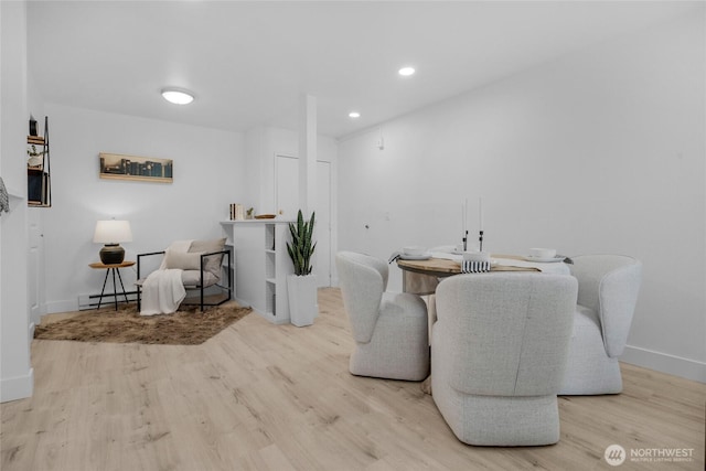 14600 NE 32nd St Unit I4, Bellevue, WA 98007 - dining area with wood finished floors, a baseboard radiator, and recessed lighting