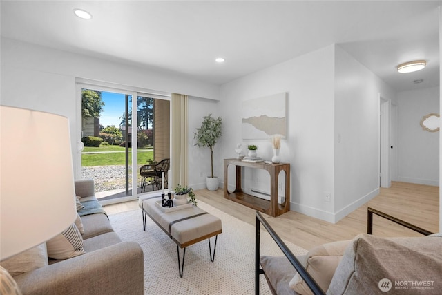 14600 NE 32nd St Unit I4, Bellevue, WA 98007 - living room featuring light wood finished floors, recessed lighting, and a baseboard radiator