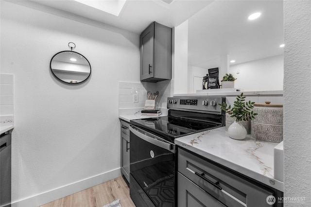 14600 NE 32nd St Unit I4, Bellevue, WA 98007 - kitchen with electric range, gray cabinetry, light wood-style floors, and light countertops