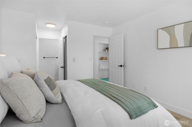 14600 NE 32nd St Unit I4, Bellevue, WA 98007 - bedroom featuring wood finished floors and baseboards