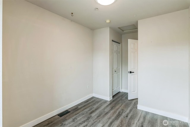 1124 S 23rd St, Tacoma, WA 98405 - unfurnished room featuring wood finished floors, baseboards, a smoke detector, and attic access