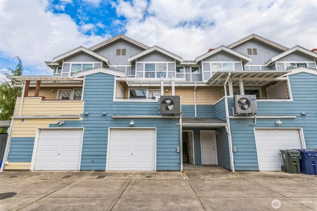 1124 S 23rd St, Tacoma, WA 98405 - view of front of home with an attached garage, driveway, a balcony, and a cooling unit
