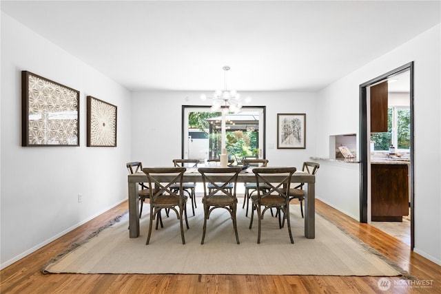 15052 253rd Ave SE, Issaquah, WA 98027 - dining room with a chandelier and light wood-style flooring