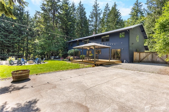 15052 253rd Ave SE, Issaquah, WA 98027 - view of front of home featuring a fire pit, a deck, and a patio