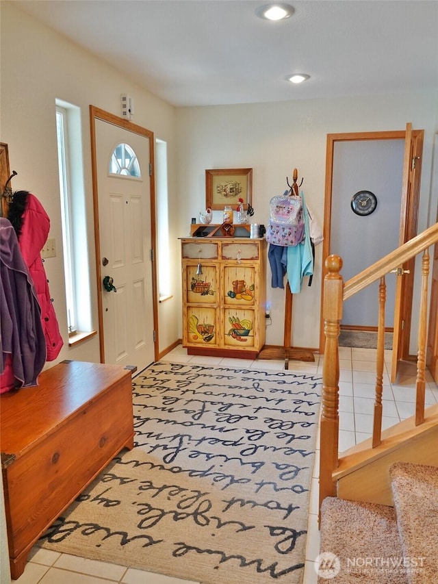 801 Hassalo Ave SE, Ocean Shores, WA 98569 - foyer entrance featuring light tile patterned floors, stairs, and baseboards