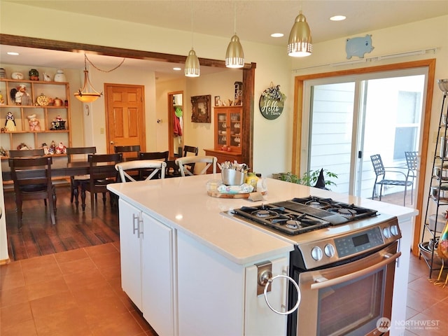 801 Hassalo Ave SE, Ocean Shores, WA 98569 - kitchen with gas range, light tile patterned floors, white cabinets, light countertops, and recessed lighting