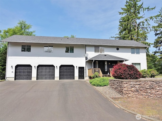 801 Hassalo Ave SE, Ocean Shores, WA 98569 - view of front of property featuring a garage and driveway