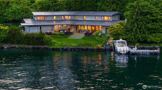 7964 E Mercer Way, Mercer Island, WA 98040 - back of property featuring a water view, metal roof, boat lift, and a wooded view