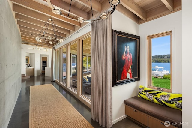 7964 E Mercer Way, Mercer Island, WA 98040 - hall with wood ceiling with exposed beams, concrete floors, and a chandelier