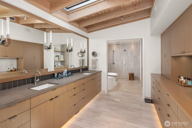 7964 E Mercer Way, Mercer Island, WA 98040 - full bathroom with double vanity, a shower, a skylight, and toilet