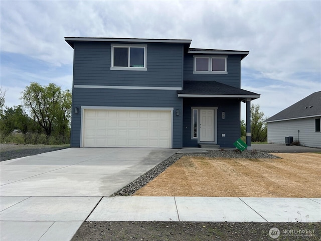507 N Ruddy Blvd, Moses Lake, WA 98837 - view of front of property featuring an attached garage, driveway, and central AC unit