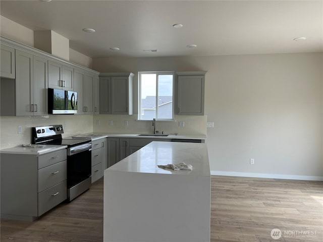507 N Ruddy Blvd, Moses Lake, WA 98837 - kitchen with stainless steel appliances, gray cabinets, light countertops, and recessed lighting
