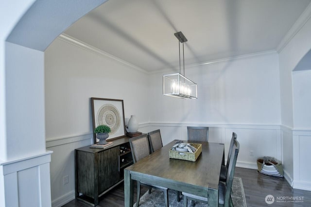 4704 204th Ct E, Spanaway, WA 98387 - dining room featuring arched walkways, dark wood-style flooring, wainscoting, ornamental molding, and a chandelier