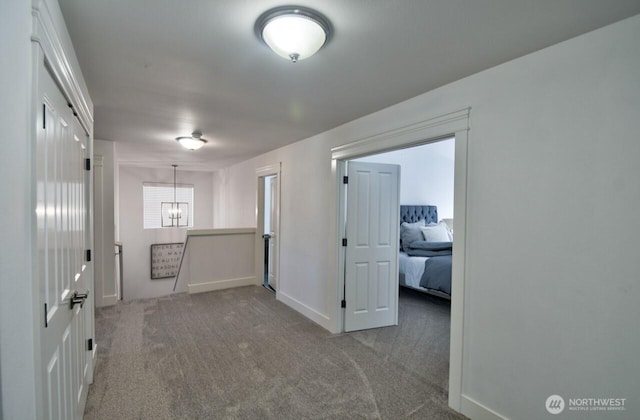 4704 204th Ct E, Spanaway, WA 98387 - carpeted empty room with a chandelier and baseboards