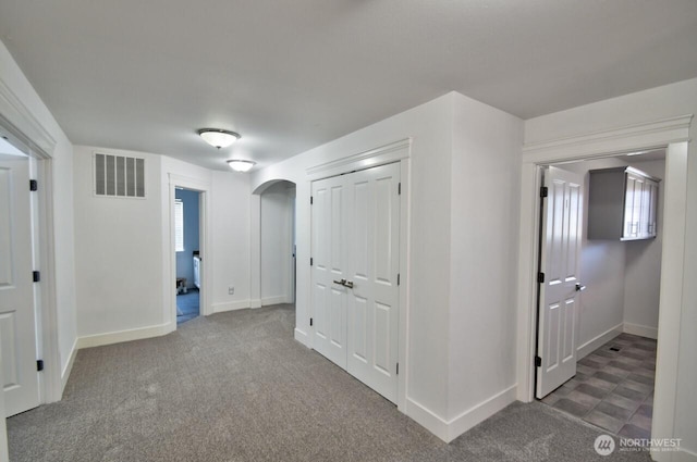 4704 204th Ct E, Spanaway, WA 98387 - hallway with arched walkways, plenty of natural light, and carpet