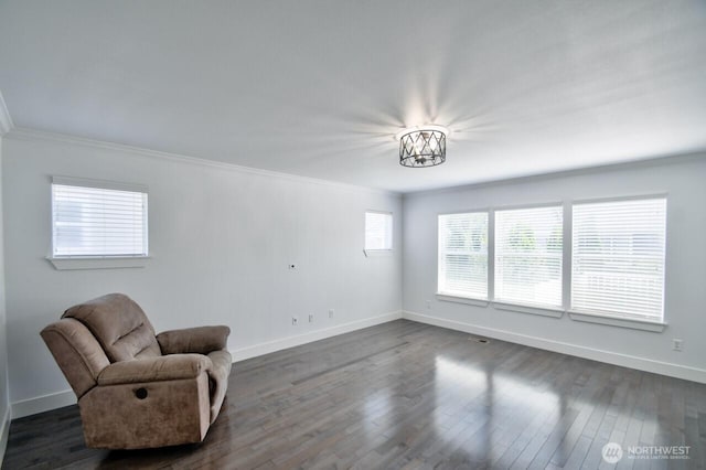 4704 204th Ct E, Spanaway, WA 98387 - unfurnished room with ornamental molding and dark wood-style floors