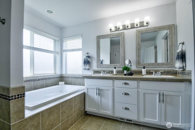4704 204th Ct E, Spanaway, WA 98387 - bathroom featuring double vanity, a bath, and tile patterned flooring