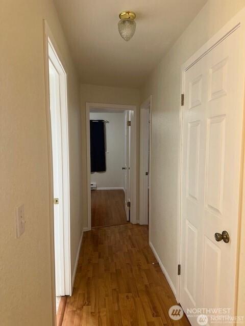 5722 122nd Pl SE Unit 235, Bellevue, WA 98006 - hall featuring light wood finished floors and baseboards