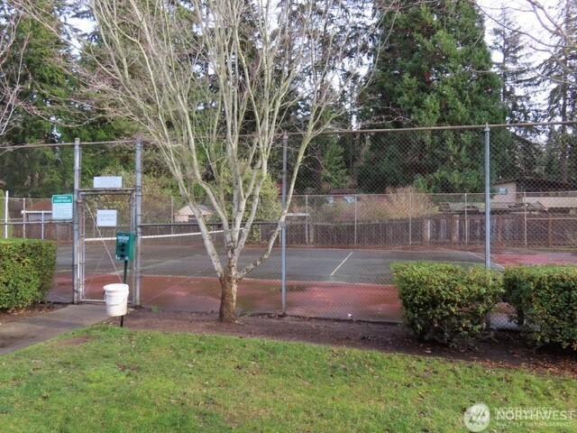 5722 122nd Pl SE Unit 235, Bellevue, WA 98006 - view of tennis court featuring a gate