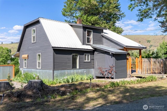 111 Norfolk Rd, Winthrop, WA 98862 - rear view of house with a metal roof and a chimney