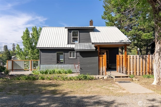 111 Norfolk Rd, Winthrop, WA 98862 - view of front of home with a chimney, covered porch, and a metal roof