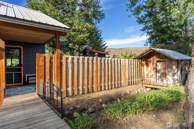 111 Norfolk Rd, Winthrop, WA 98862 - wooden terrace with a storage shed