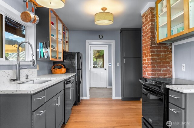 111 Norfolk Rd, Winthrop, WA 98862 - kitchen with black / electric stove, gray cabinetry, dishwashing machine, and light wood-type flooring