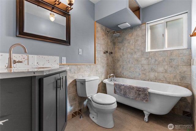 111 Norfolk Rd, Winthrop, WA 98862 - full bathroom featuring tile walls, vanity, tile patterned floors, and washtub / shower combination