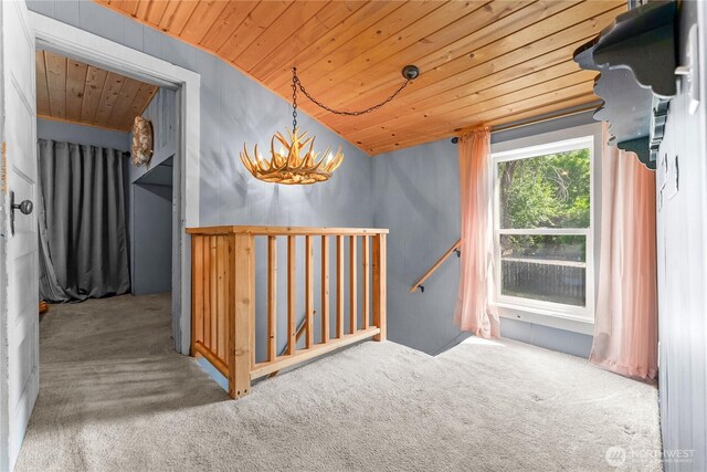 111 Norfolk Rd, Winthrop, WA 98862 - staircase with wood ceiling, carpet floors, vaulted ceiling, and a chandelier