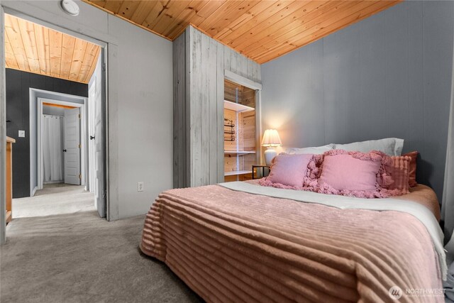 111 Norfolk Rd, Winthrop, WA 98862 - bedroom featuring wooden ceiling, carpet, wooden walls, and vaulted ceiling