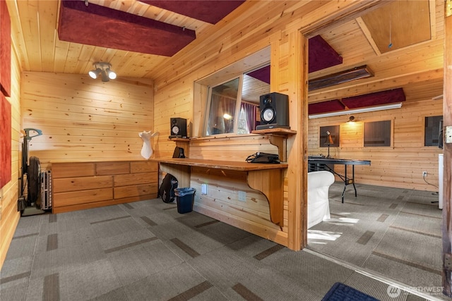 111 Norfolk Rd, Winthrop, WA 98862 - carpeted office featuring wood walls and a wood ceiling with exposed beams