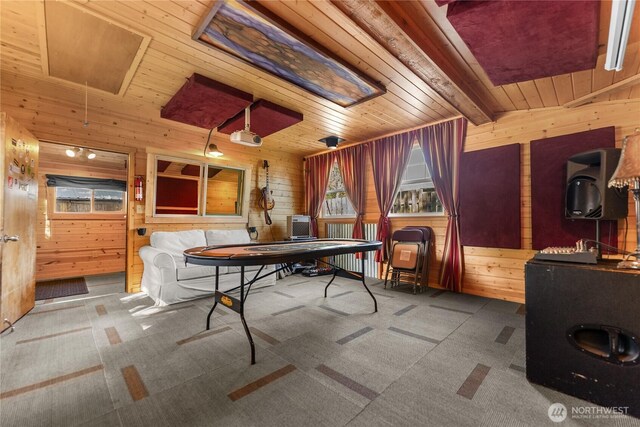 111 Norfolk Rd, Winthrop, WA 98862 - game room featuring wooden walls, a wooden ceiling with exposed beams, carpet, and attic access