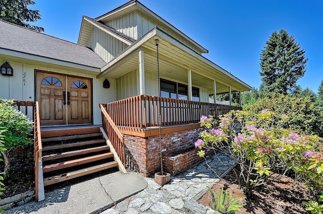 2781 Lake Whatcom Blvd, Bellingham, WA 98229 - view of front of home featuring board and batten siding, roof with shingles, and a porch